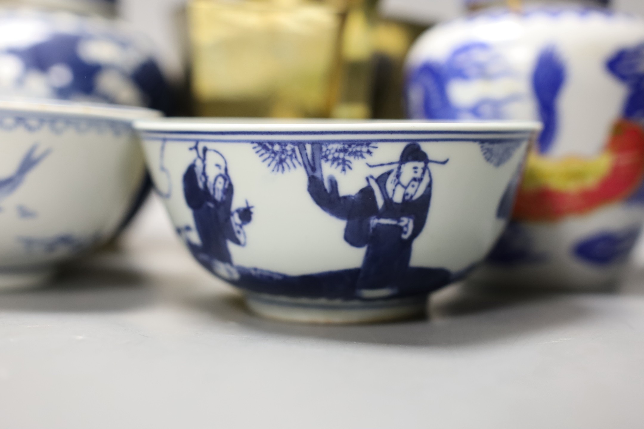 A Chinese brass tea caddy and kettle together with three similar blue and white porcelain bowls, three jars and covers and a Japanese vase